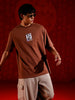 Men's Oversized Tee with Illustrated Patch Detail | Brown