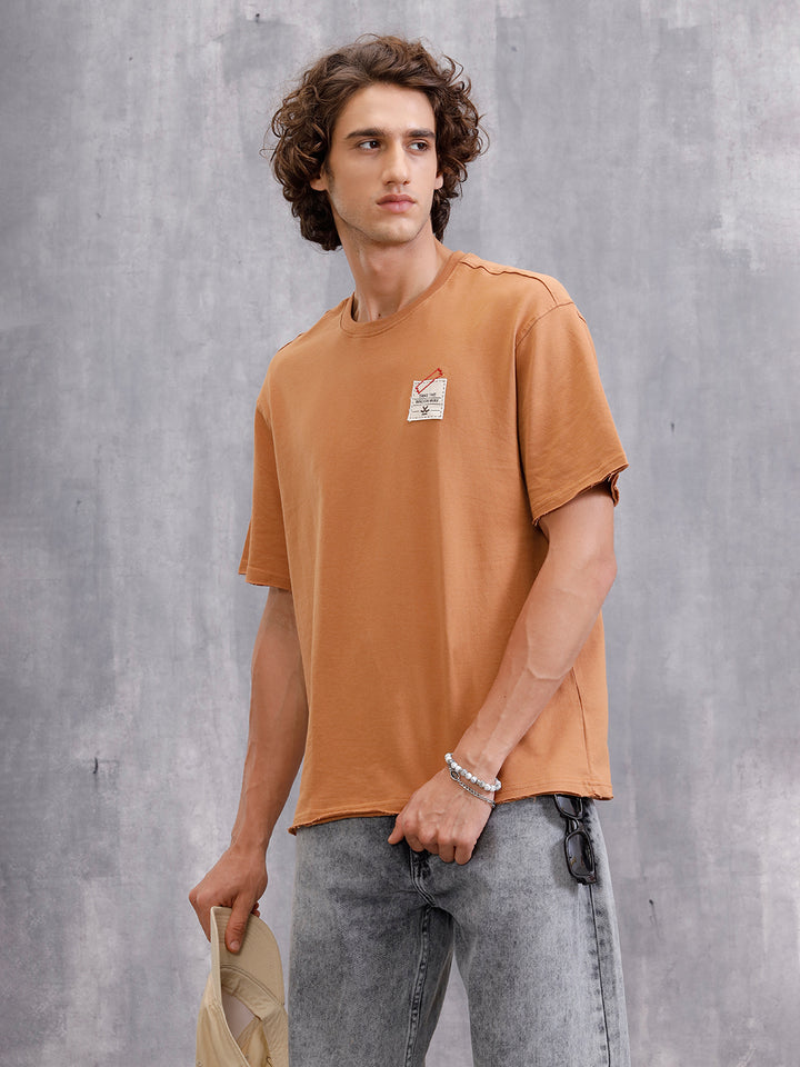 Solid Oversized T-Shirt With Printed Canvas Patch And Raw Edge Detail | Brown