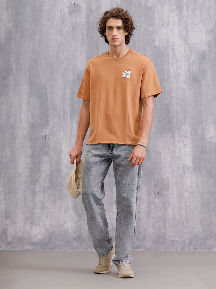 Solid Oversized T-Shirt With Printed Canvas Patch And Raw Edge Detail | Brown