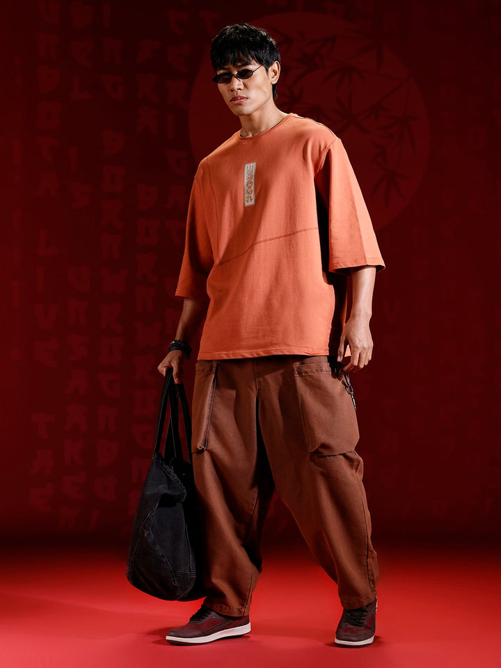 Men’s oversized 3/4 sleeve T-shirt with chest print & tonal stich detail | Rust