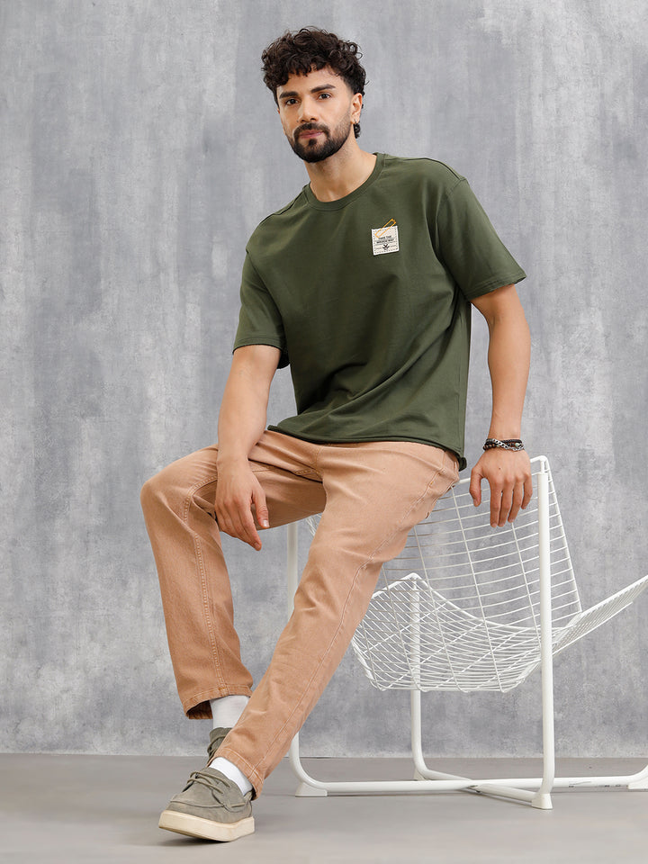 Solid Oversized T-Shirt With Printed Canvas Patch And Raw Edge Detail | Olive