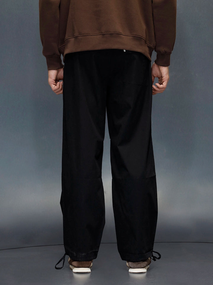 Men's loose fit trouser with draw string in the hem  | Black
