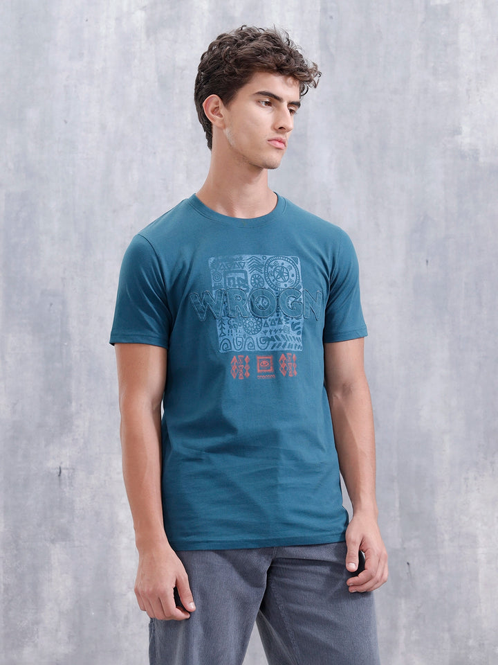 Ancient Markings Inspired Slim Fit Patchwork Brand Carrier T-Shirt | Teal
