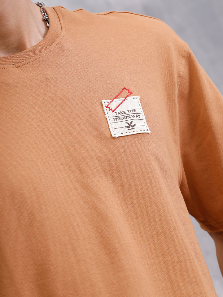 Solid Oversized T-Shirt With Printed Canvas Patch And Raw Edge Detail | Brown