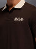 Men's slim-fit polo tee with contrast collar & graphic chest print | Brown