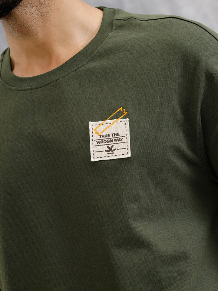 Solid Oversized T-Shirt With Printed Canvas Patch And Raw Edge Detail | Olive