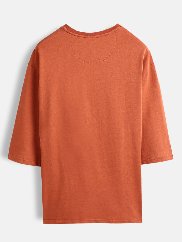 Men’s oversized 3/4 sleeve T-shirt with chest print & tonal stich detail | Rust
